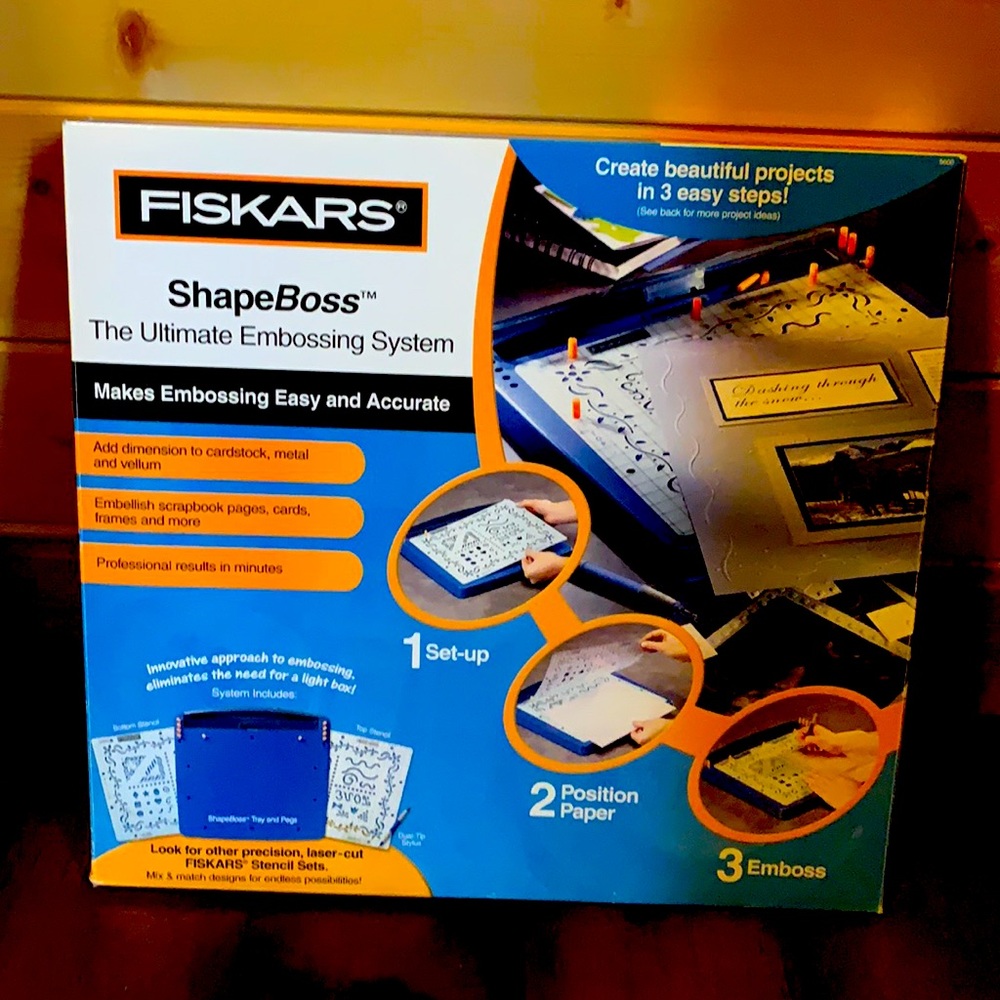Fiskars embossing manual hand held system.